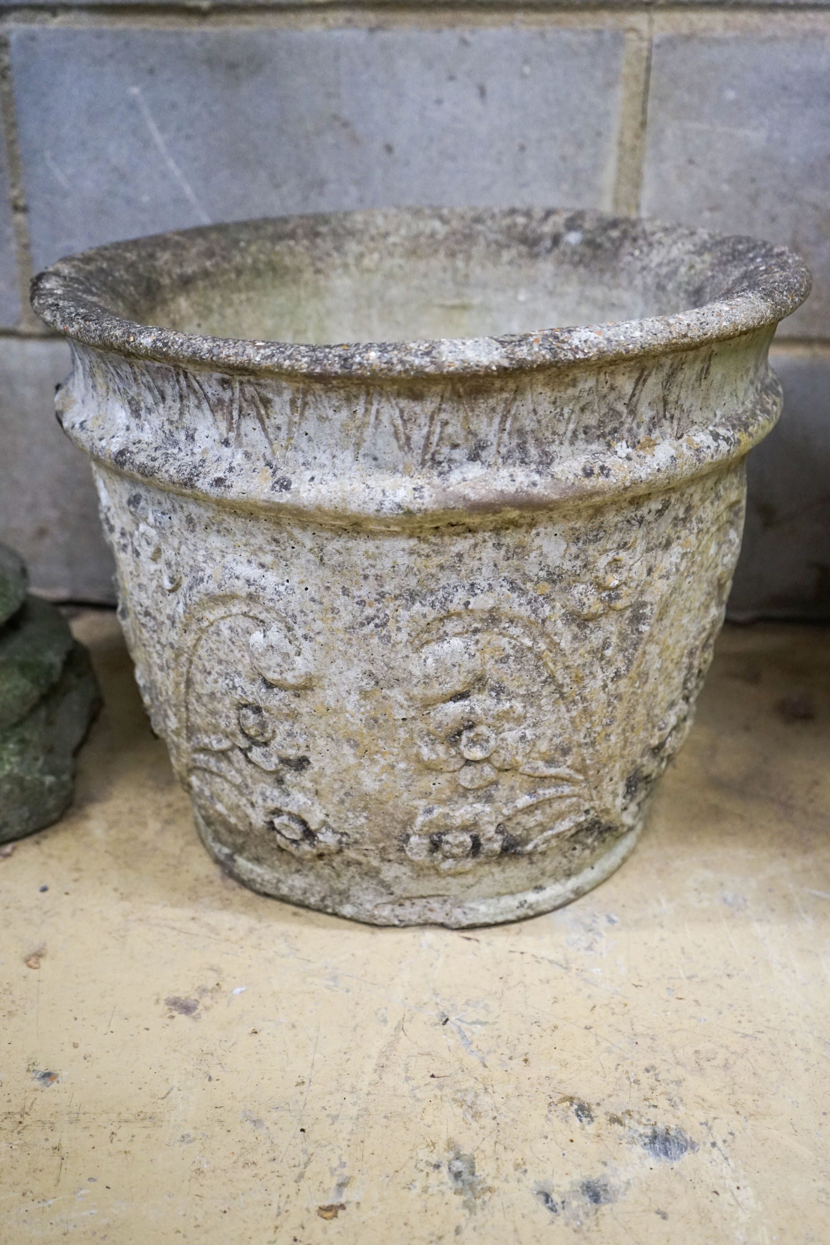 Four assorted reconstituted stone garden urns and a galvanised tub